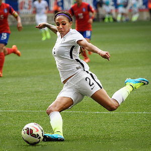Photo of Sydney Leroux kicking a soccer ball